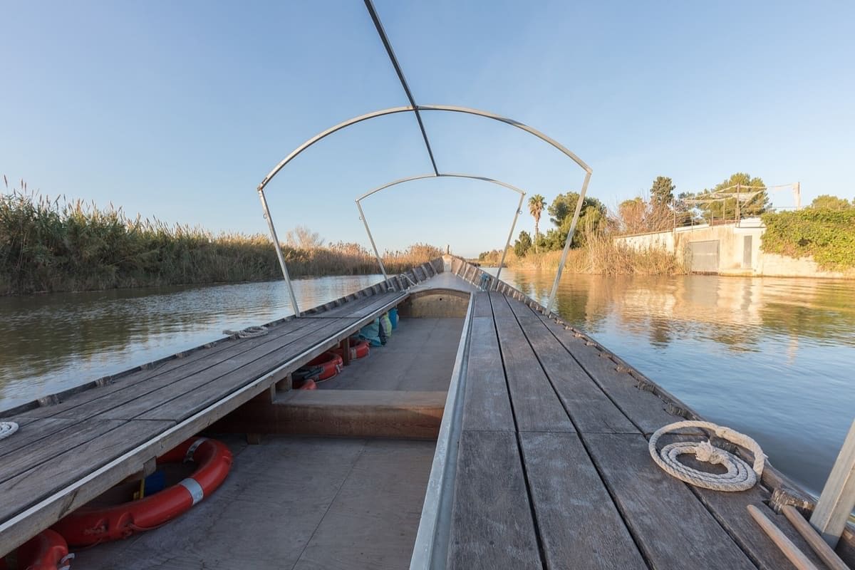 Traditional wooden albuferenc boat on the lagoon in L’Albufera Natural Park