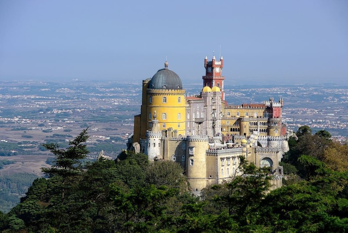 Colourful Pena Palace on a forested hill in Sintra, Portugal
